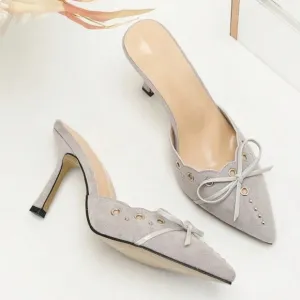 Light pale gray studded detail bow front faux suede mule heels