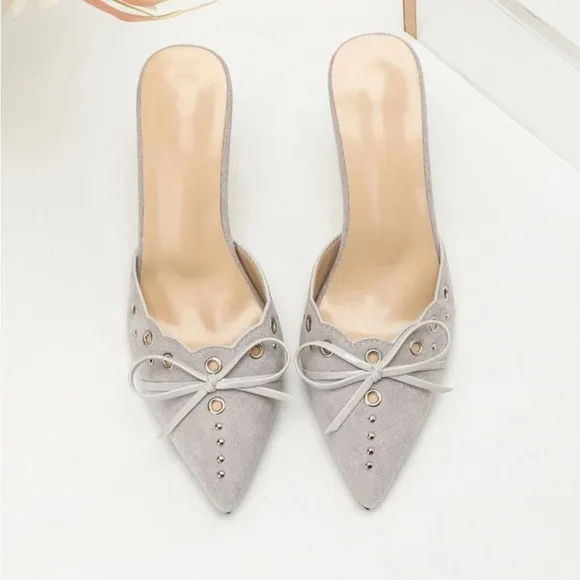 Light pale gray studded detail bow front faux suede mule heels
